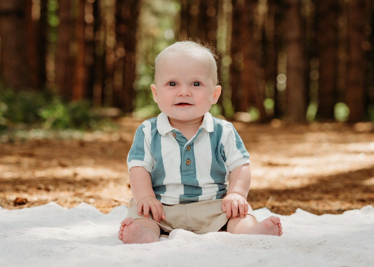 Tiny Explorers session - a baby exploring outdoors during a relaxed photography session